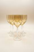 Set of 6 Pier 1 P1C1 amber blown glass water goblets with clear stems in excellent condition on an invory background. 
